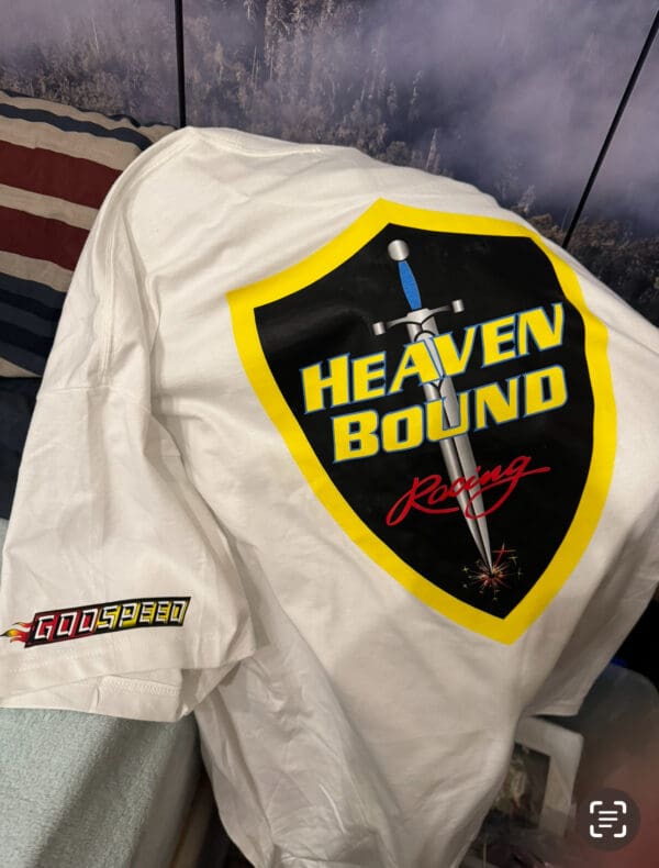 A white jacket with a yellow and black patch on it