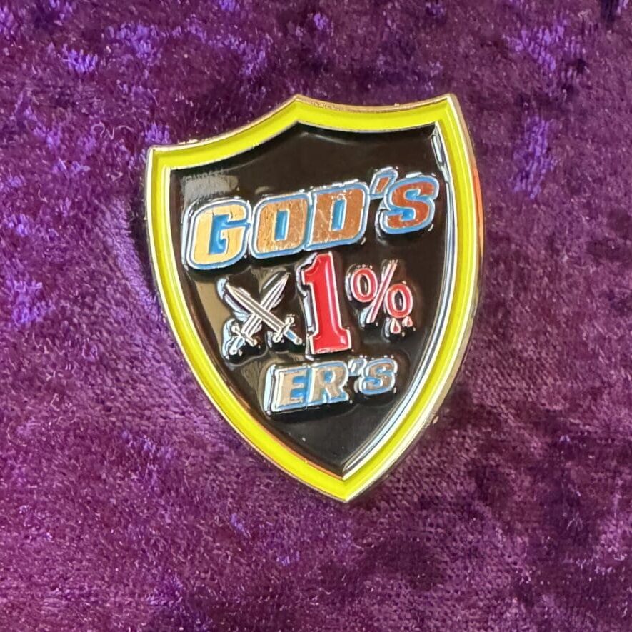 Here's an alt tag for the image: God's 1%ers shield pin.