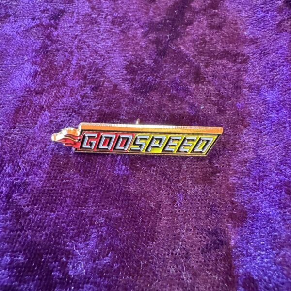 Here's an alt tag for the image: `Godspeed pin with flame`