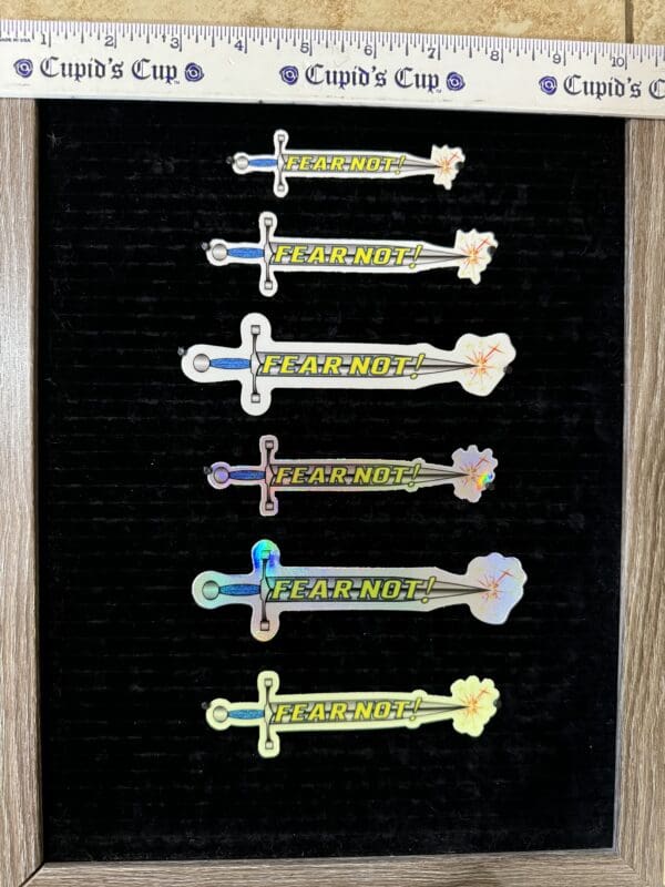 Six iridescent swords: Fear Not! stickers.