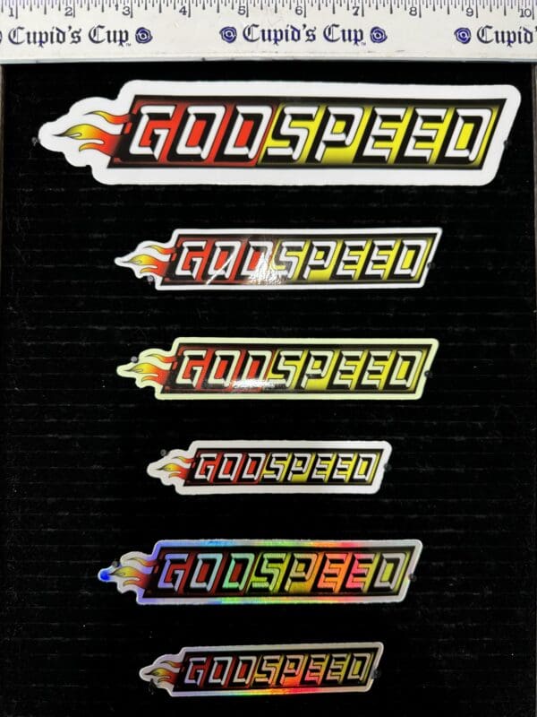 Here's an alt tag for the image: `Godspeed stickers, various sizes`