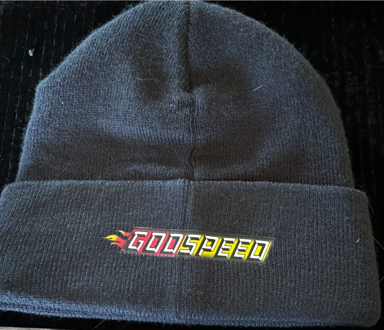 Black Godspeeed beanie, cuffed.